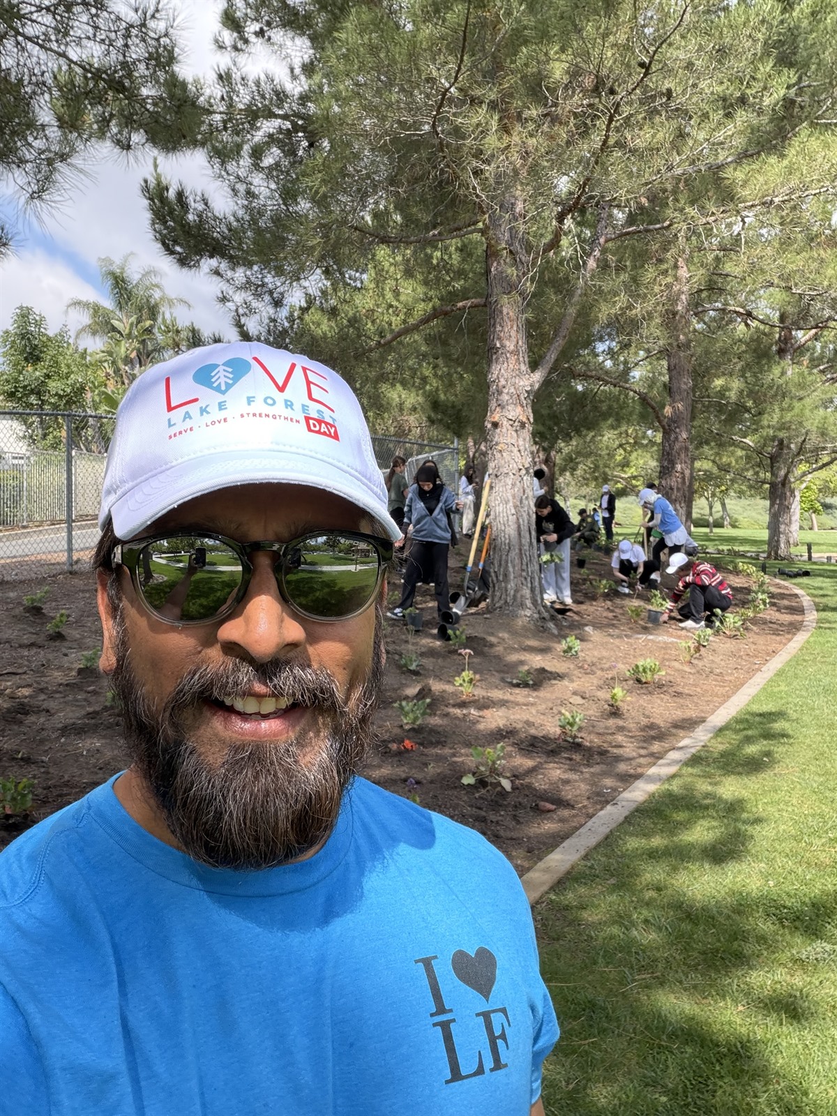 Anil Patel volunteering with Love Lake Forest as community members improve a local park